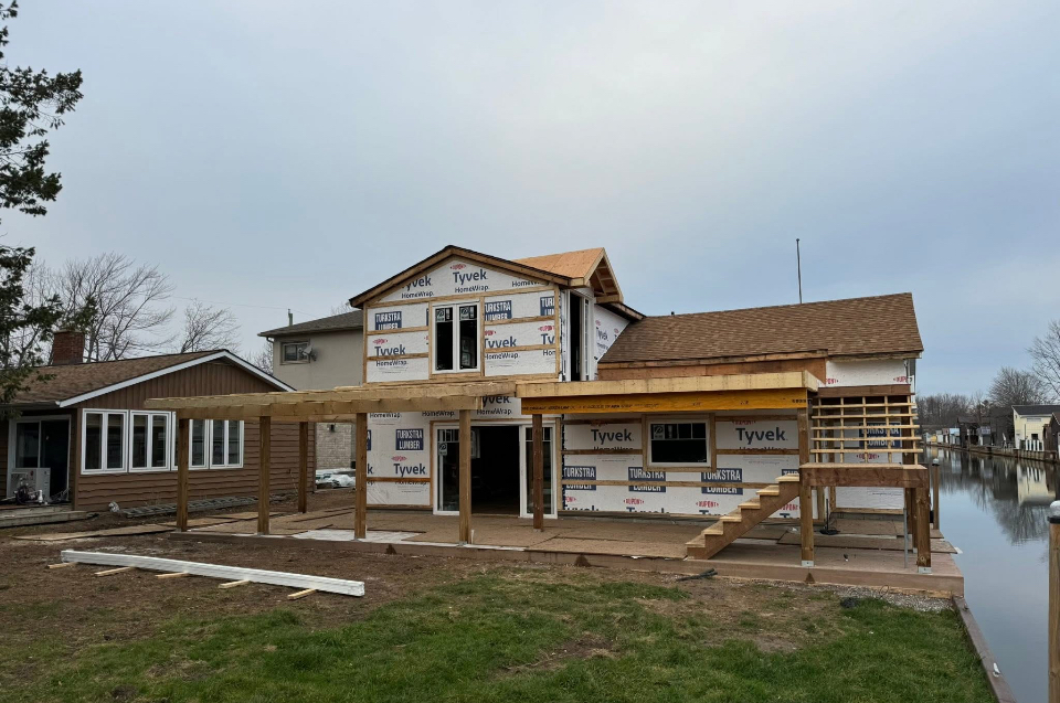 Second storey addition framed and house-wrapped during construction by Kuiper Construction